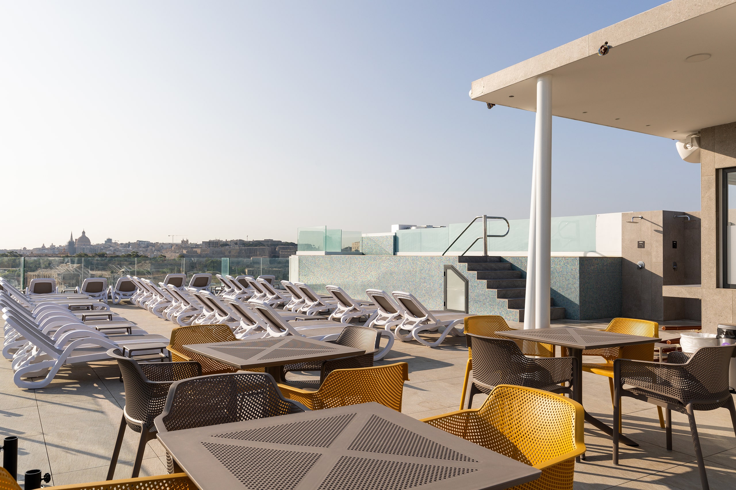 Spend the day by our rooftop pool.