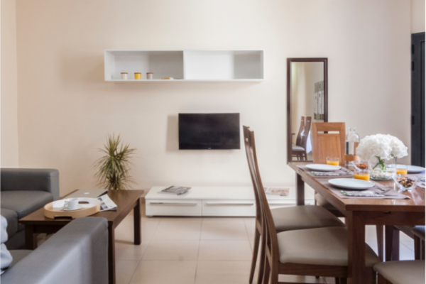 Blubay apartment with dining table, sofa and tv