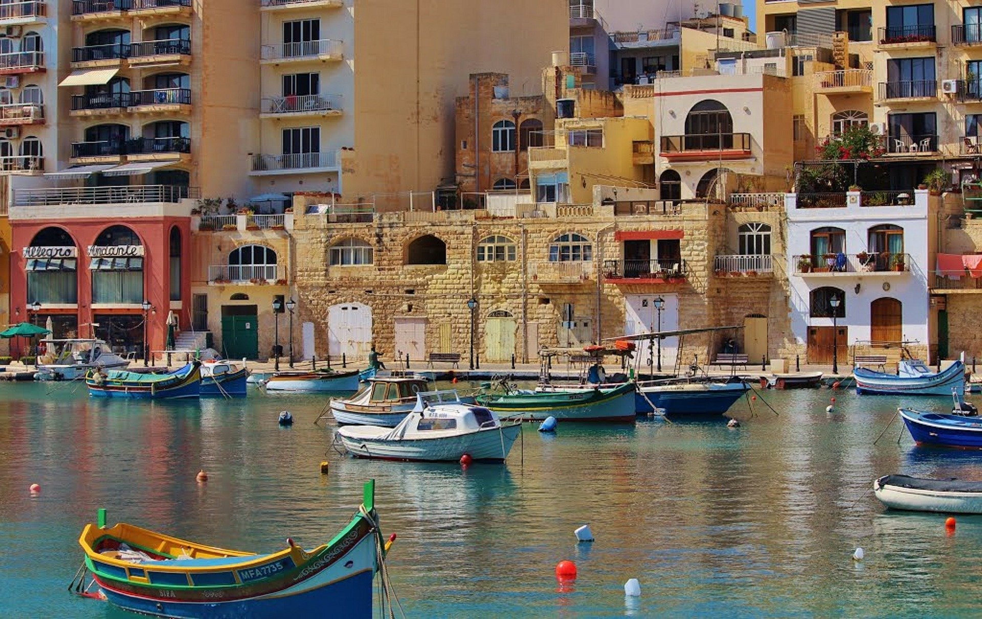 a view from Malta sea with boats sailing on it