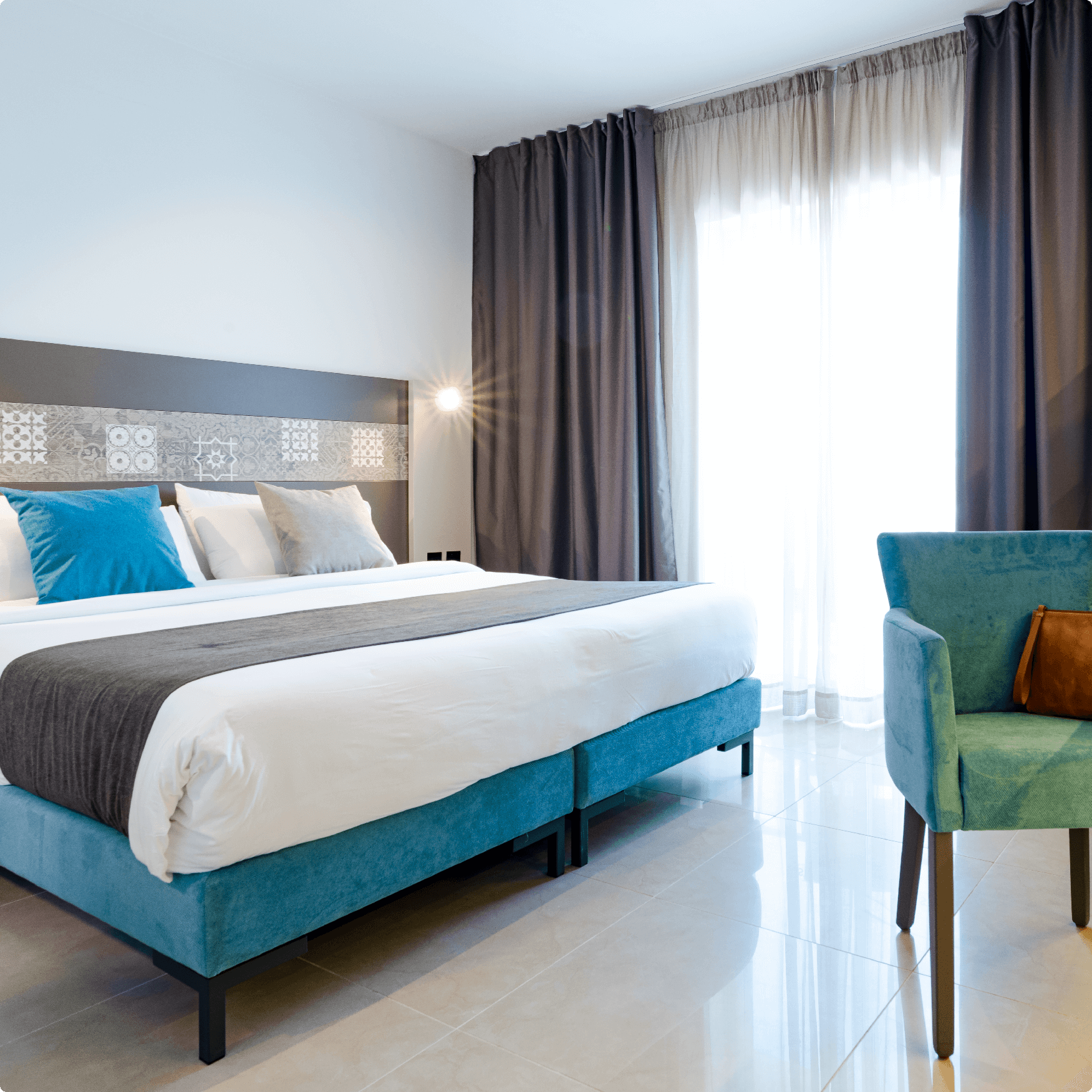 an image of a standard room with bed and window and sofa at St hotels Malta