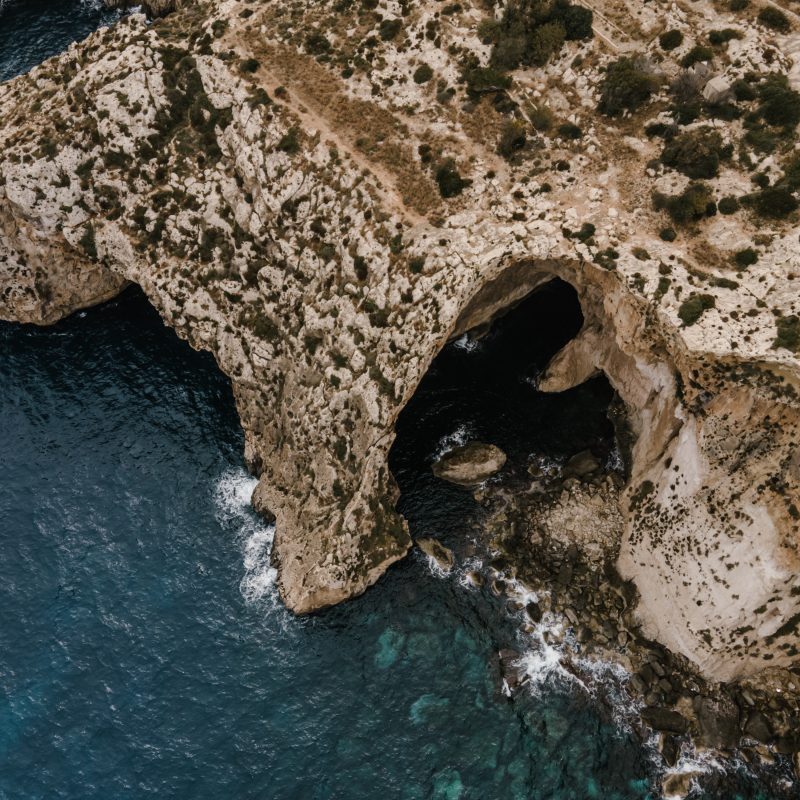 an aerial image of Malta nature and its beautiful sea that shows tourism attractions to tourists who stay at ST hotels