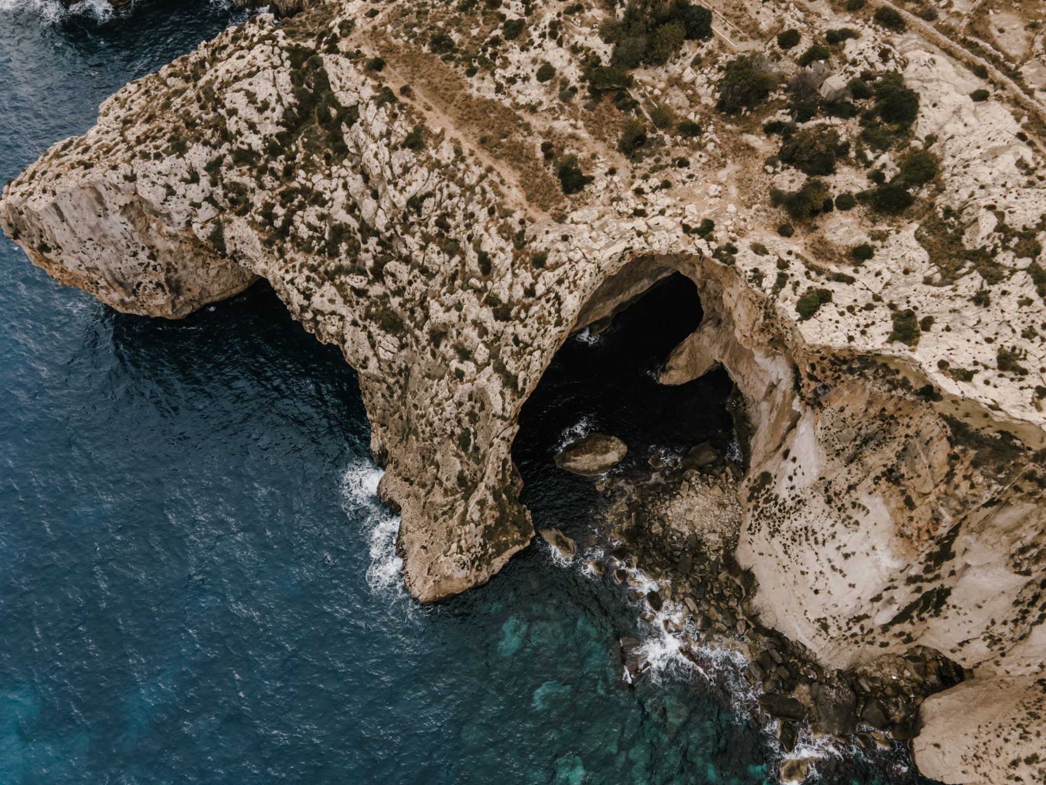 an aerial image of Malta nature and its beautiful sea that shows tourism attractions to tourists who stay at ST hotels